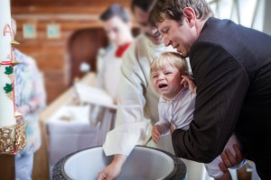 Little baby boy being baptized