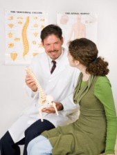 Friendly Chiropractor with Patient